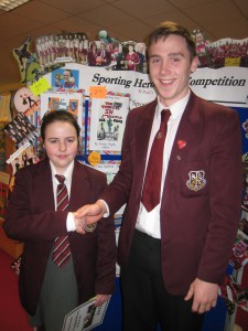 Year 8 pupil Aoibheann Murphy, winner of the Bookmark Competition with Ciaron O'Hanlon, her sporting hero and captain of the football team!
